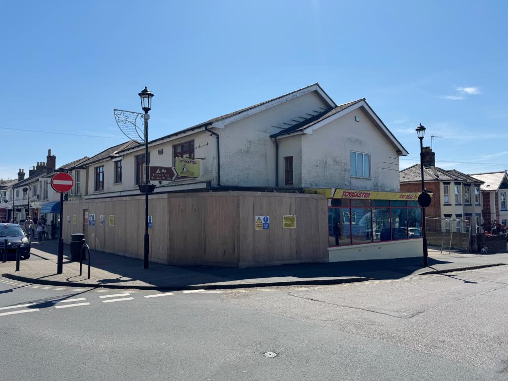 Lot: 66 - FREEHOLD TOWN CENTRE INVESTMENT - A Photograph Showing the Full Extent of the Corner Location